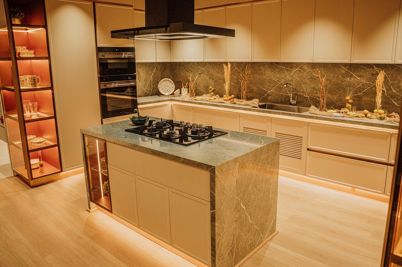 Luxury kitchen with marble island and warm ambient lighting
